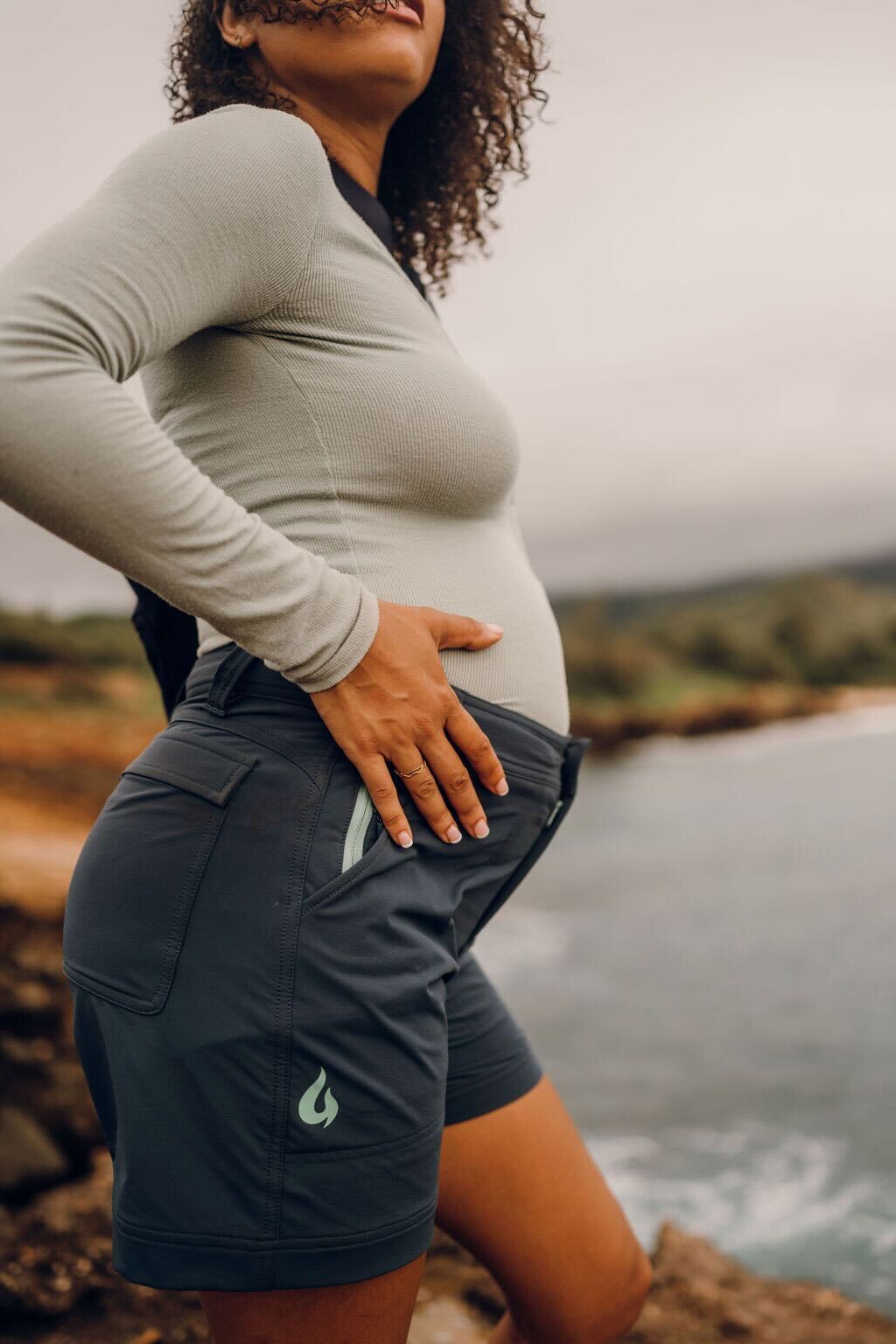 Pregnant woman wearing Gnara Go There shorts in Slate