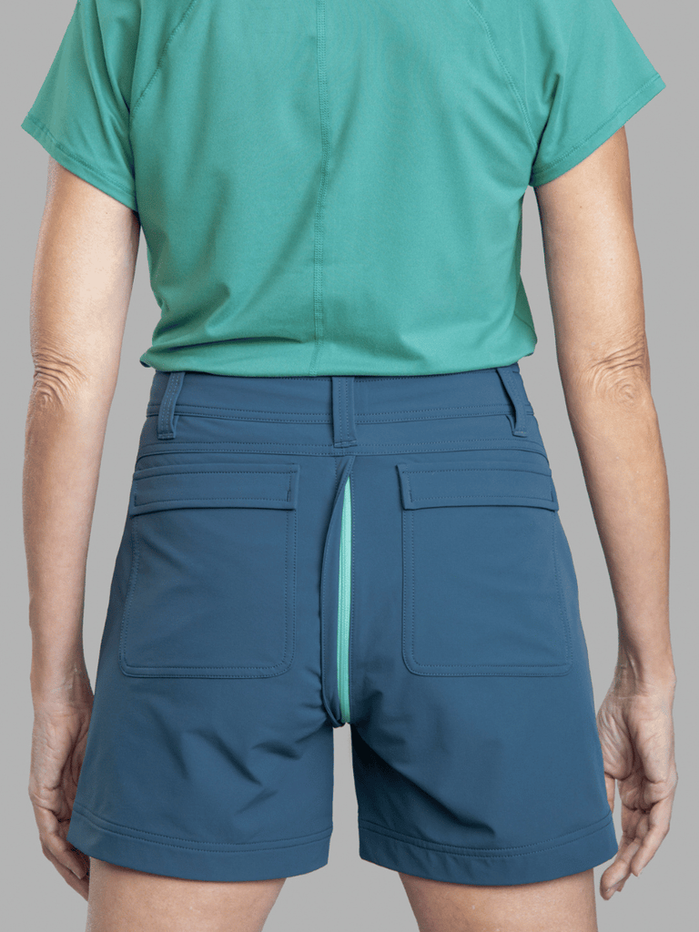 Photo of model in Gnara Go There Shorts in Crested Butte Slate showing the GoFly Zipper exposed