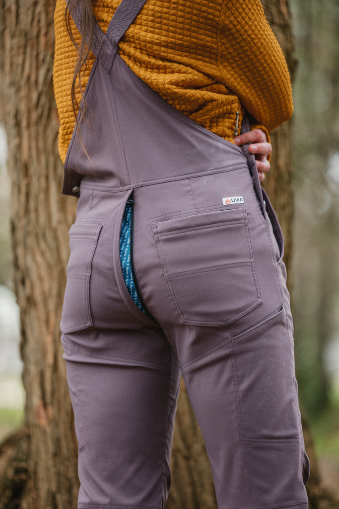 Photo of GoFly zipper open and exposed in Ecotrek overalls in Plum