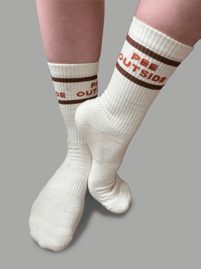 Studio image of "Pee Outside" Socks
