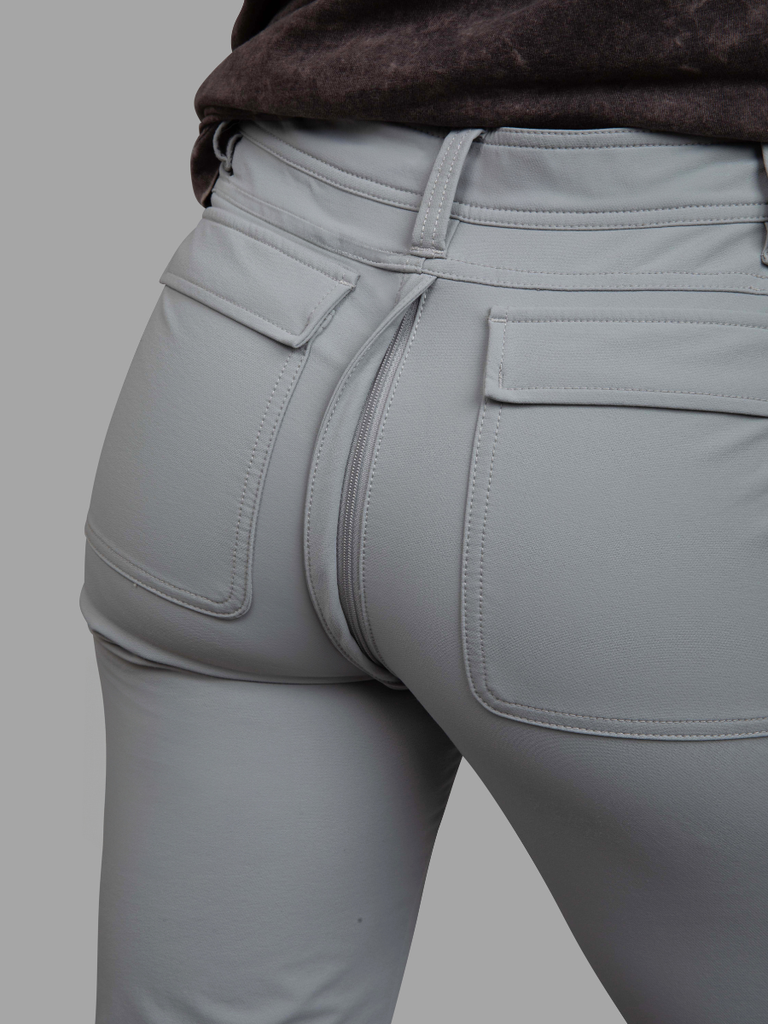 Photo of model in Gnara Go There Pants in Ash showing the GoFly Zipper exposed