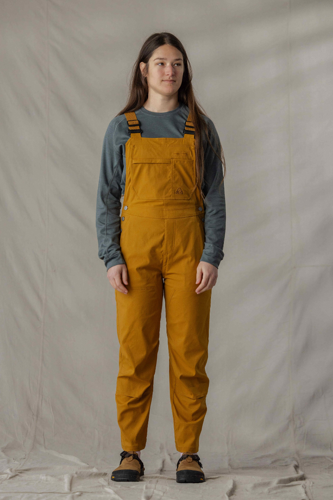 Full body photo of model in Ecotrek overalls in Caramel