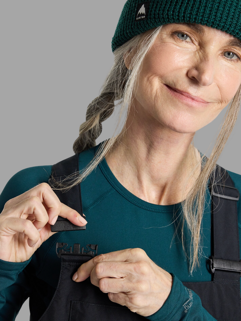 Model highlighting buckle feature on Black Bib