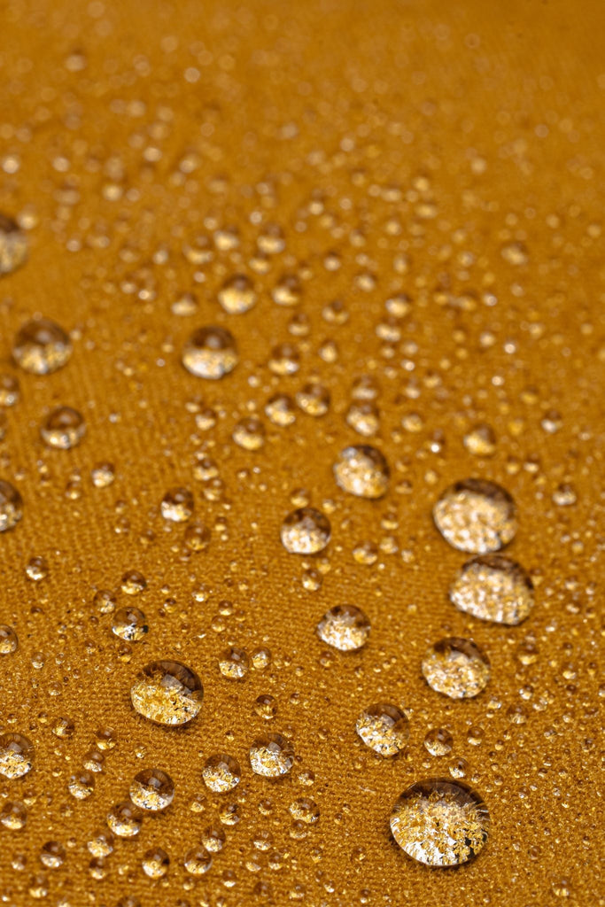 Water droplets on C0 DWR fabric of Ecotrek overalls